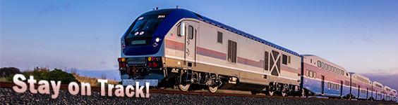 An image of a passenger train traveling into the frame from the right. To the left of the front of the train is text which reads stay on track.