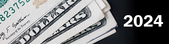 closeup photo of the corners of several twenty USA dollar bills next to text which reads twenty twenty-four